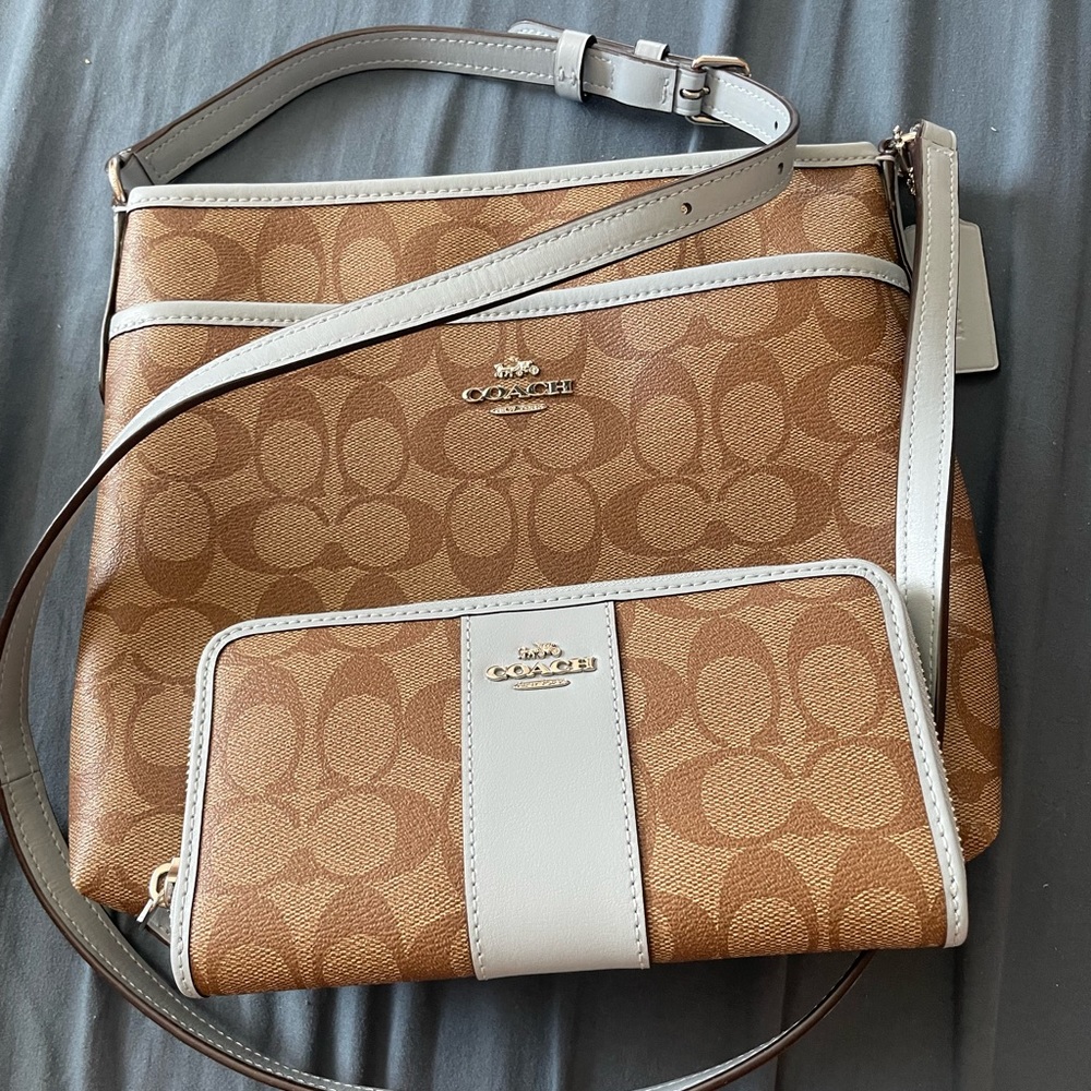 Coach crossbody. Light blue trim. With matching wallet.